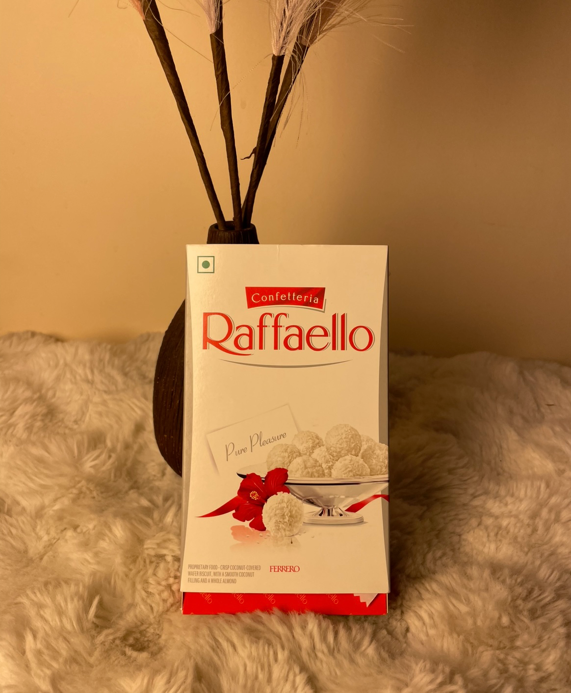 A luxurious coconut-almond confection with a crispy wafer shell, smooth creamy center, and crunchy almond heart, perfect for gifting or special moments.
