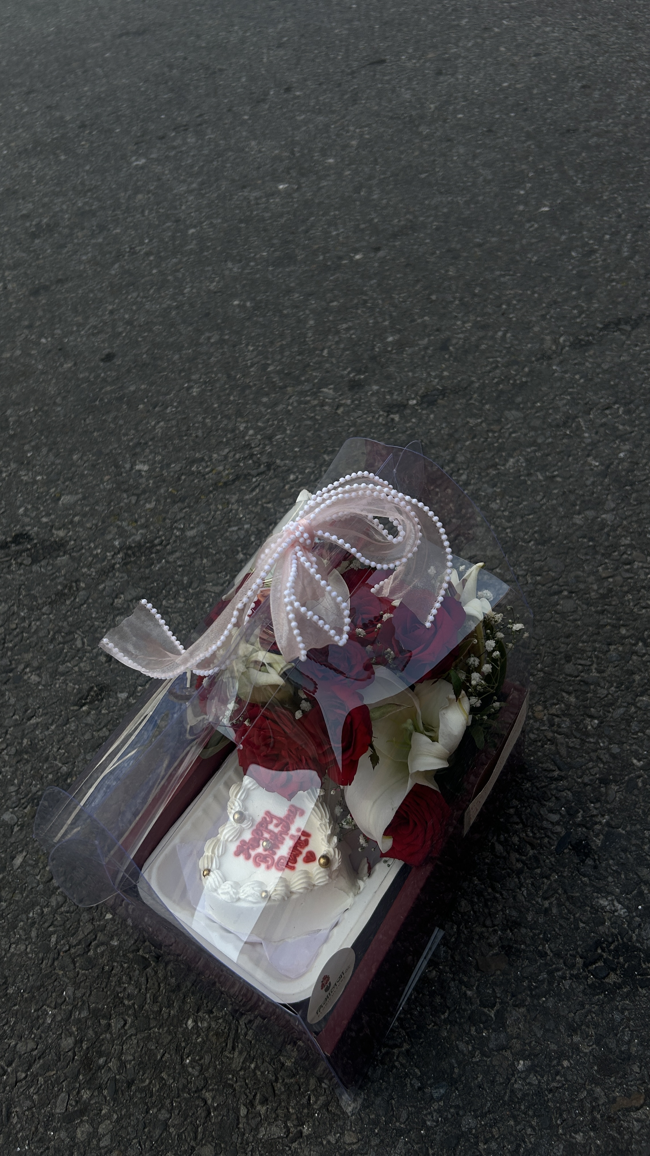 Sweet Romance Gift Set A beautiful combination of elegant white lilies, classic red roses, and a cute bento cake, creating a perfect balance of flowers and sweetness. A thoughtful gift for someone special on their memorable day.