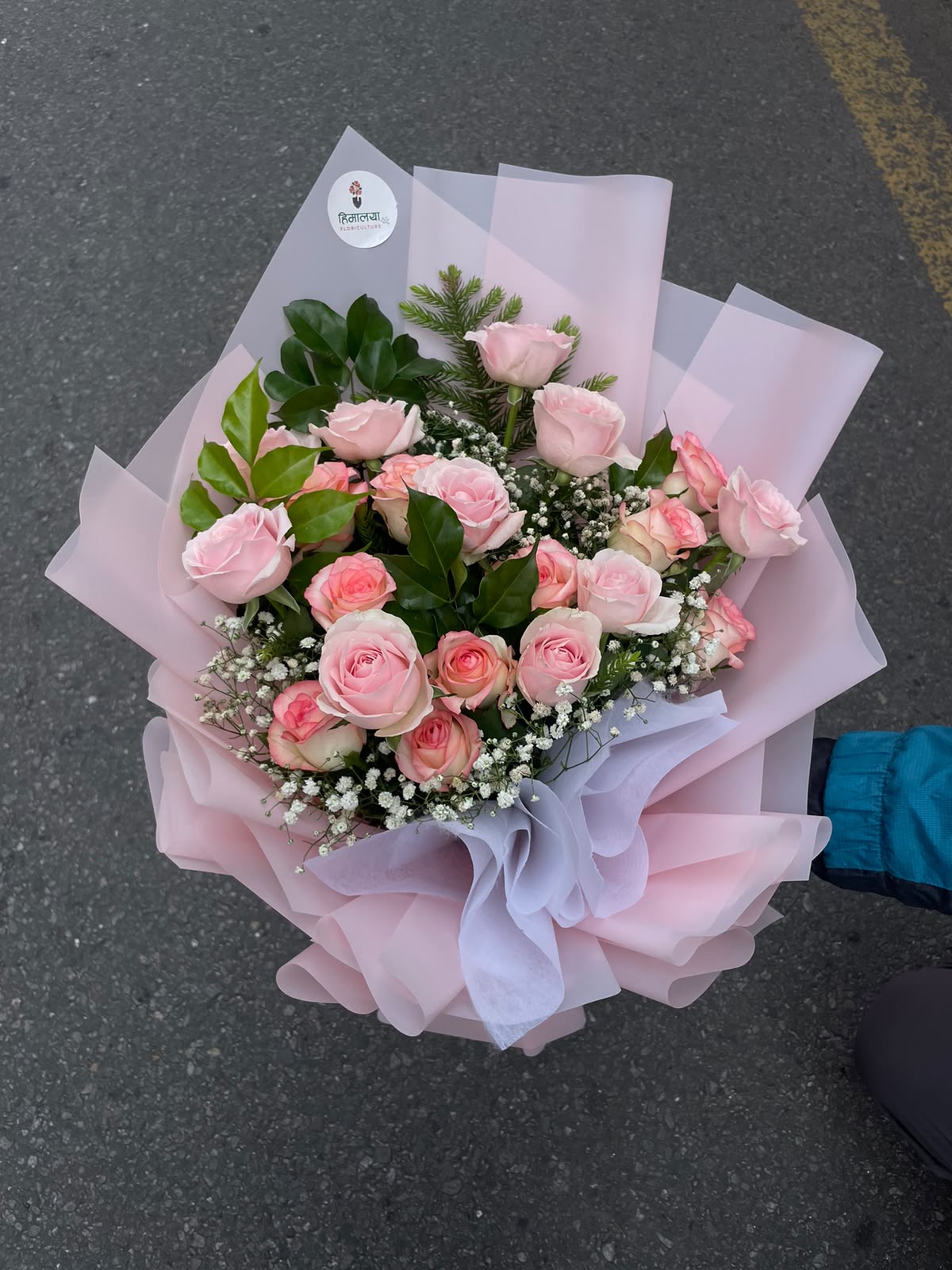 A soft and elegant bouquet featuring 20 stems of pastel pink roses, beautifully arranged and wrapped in a delicate baby pink wrapper. The gentle color combination creates a sweet, romantic, and sophisticated presentation.