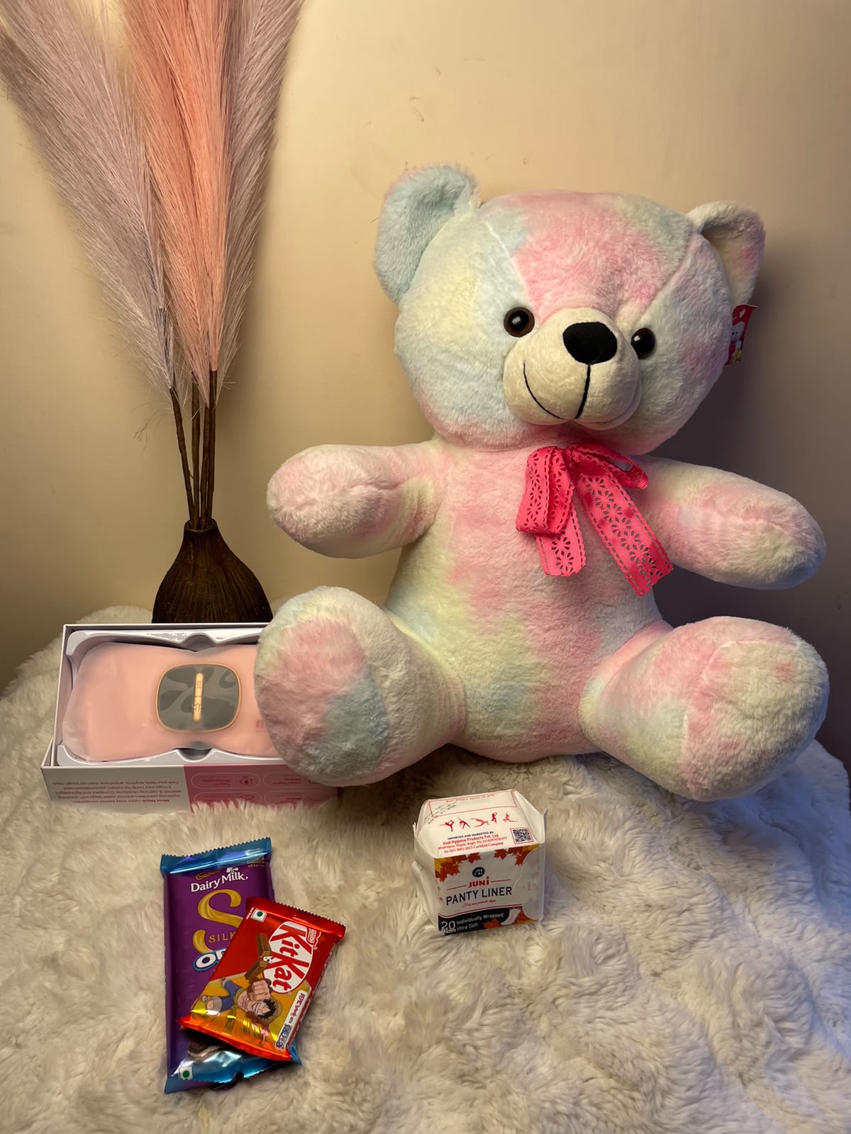 This caring gift set combines practical period support with favorite chocolate treats, making it a warm and thoughtful surprise for someone special.