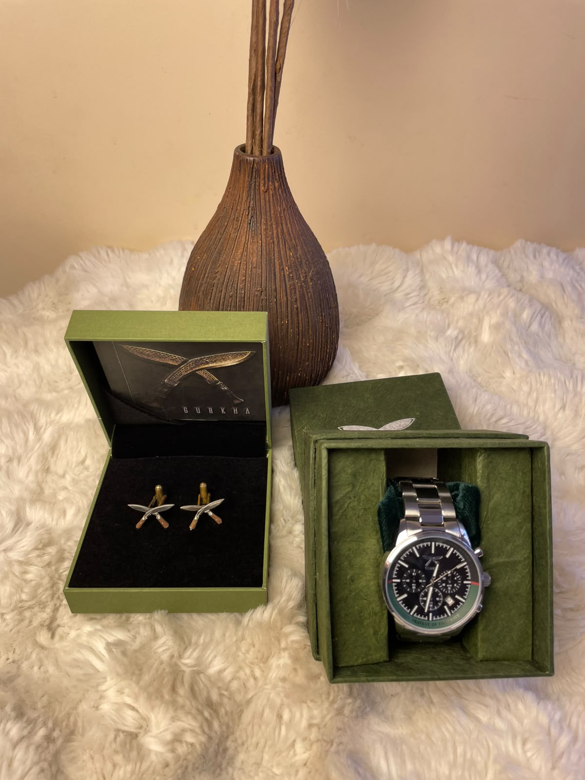 Classic Men's Gift Set A sophisticated gift combination featuring 1 stylish watch and 1 pair of Khukuri brooches/badges. The combination brings together a timeless accessory with a traditional-inspired element, making it a distinctive and memorable gift.