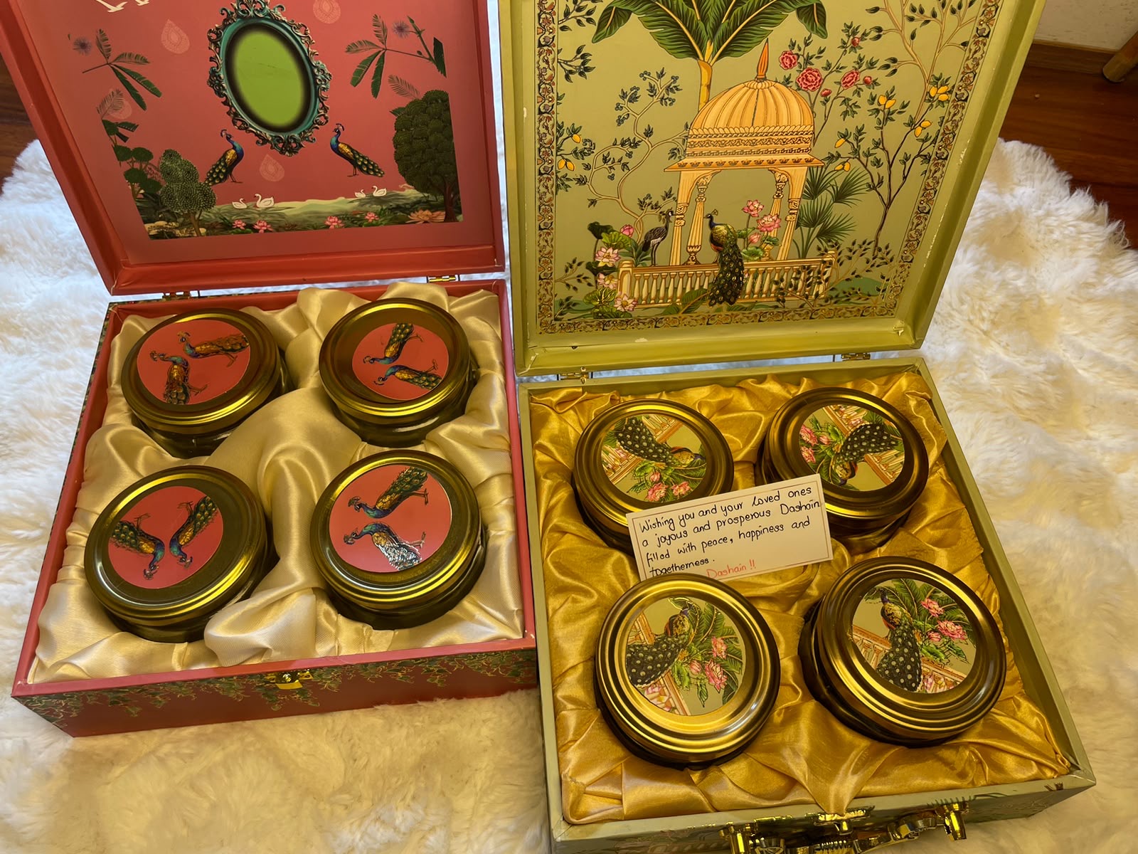 A premium gift box featuring four jars of assorted dry fruits and nuts, presented with a personalized message for a warm festive touch.