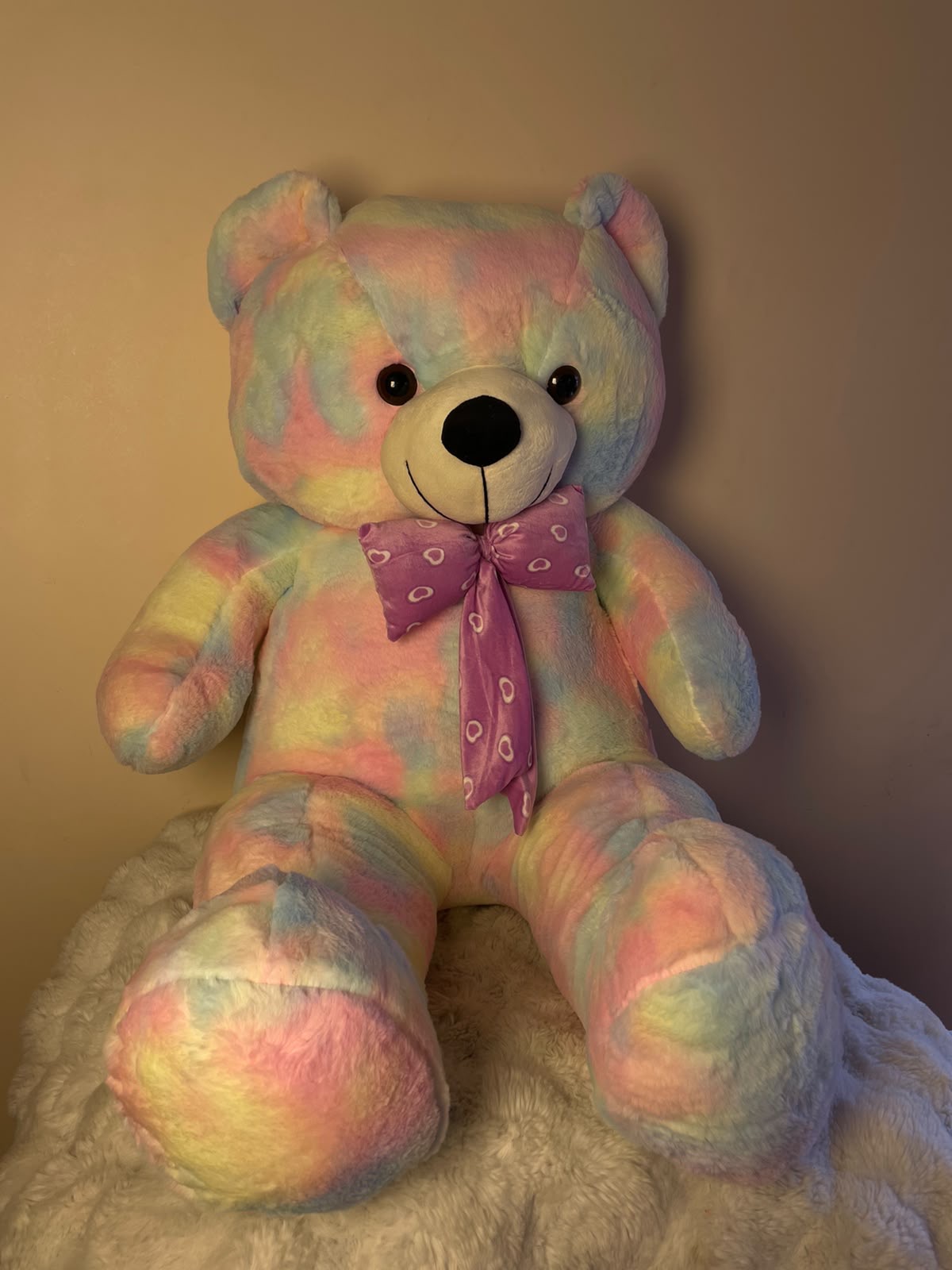 Rainbow Cuddle Bear Its bright pastel colors create a fun and cheerful gift presentation.