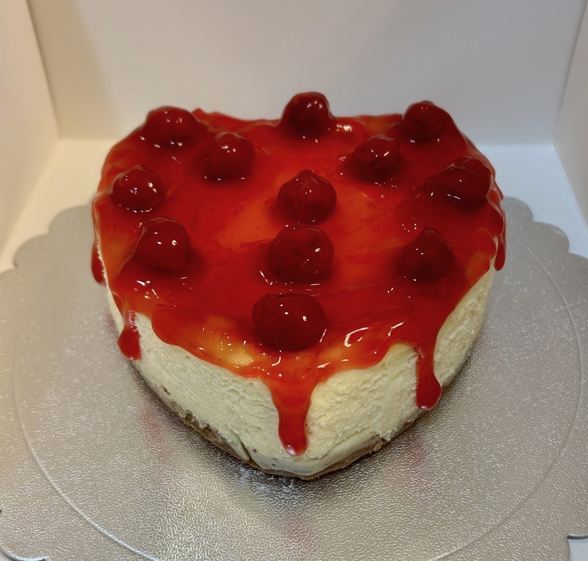 A beautifully crafted 1-pound heart-shaped cheesecake finished with a delicious cherry topping. Its romantic heart shape and elegant presentation make it a thoughtful choice for birthdays, anniversaries, Valentine's Day, and special surprises.