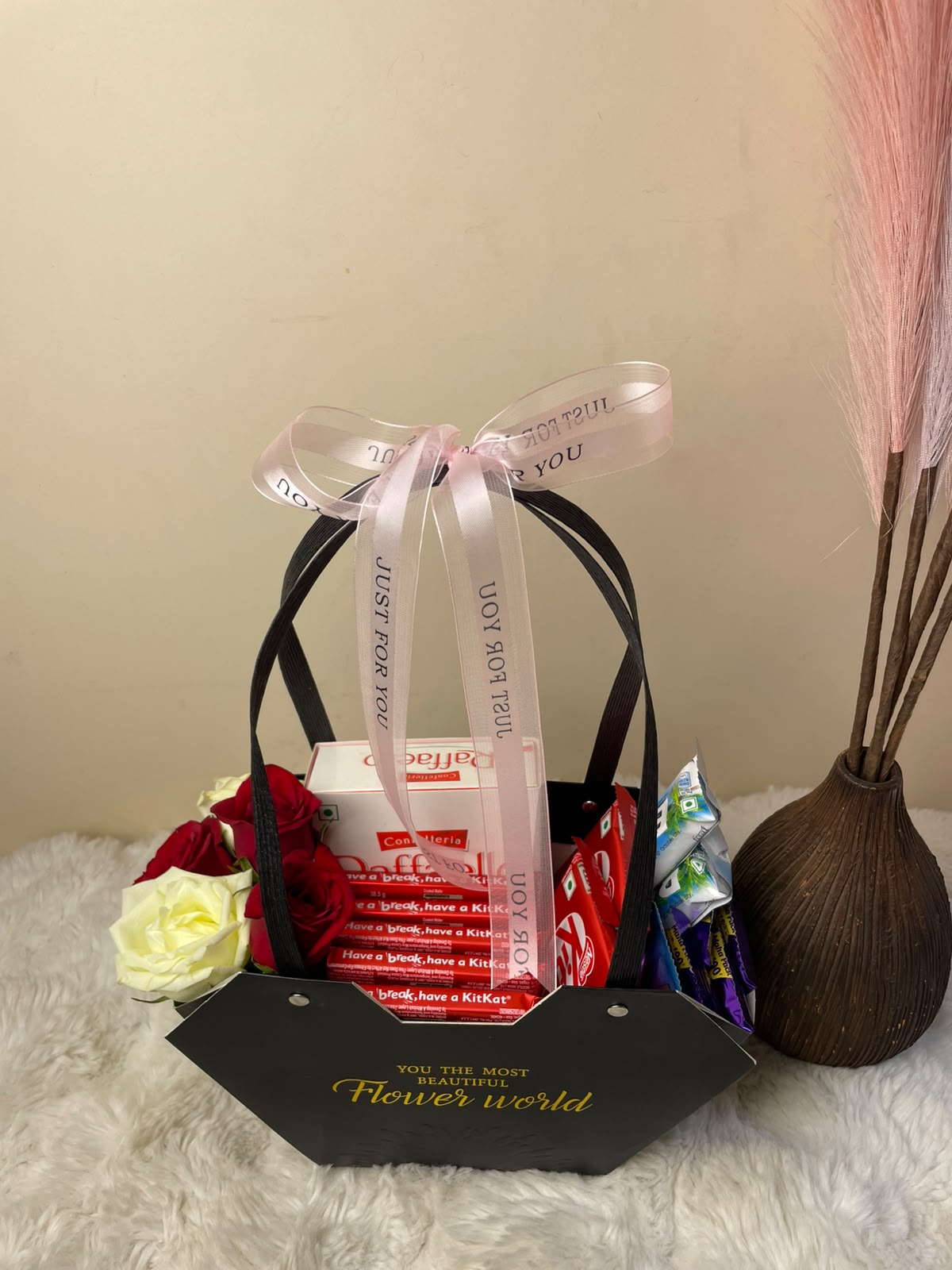 Chocolate Day Gift Basket Designed for sharing sweetness and affection, this chocolate hamper combines popular chocolate treats with a colorful floral touch. It is a lovely choice for Chocolate Day, birthdays, anniversaries, romantic surprises, and special celebrations.