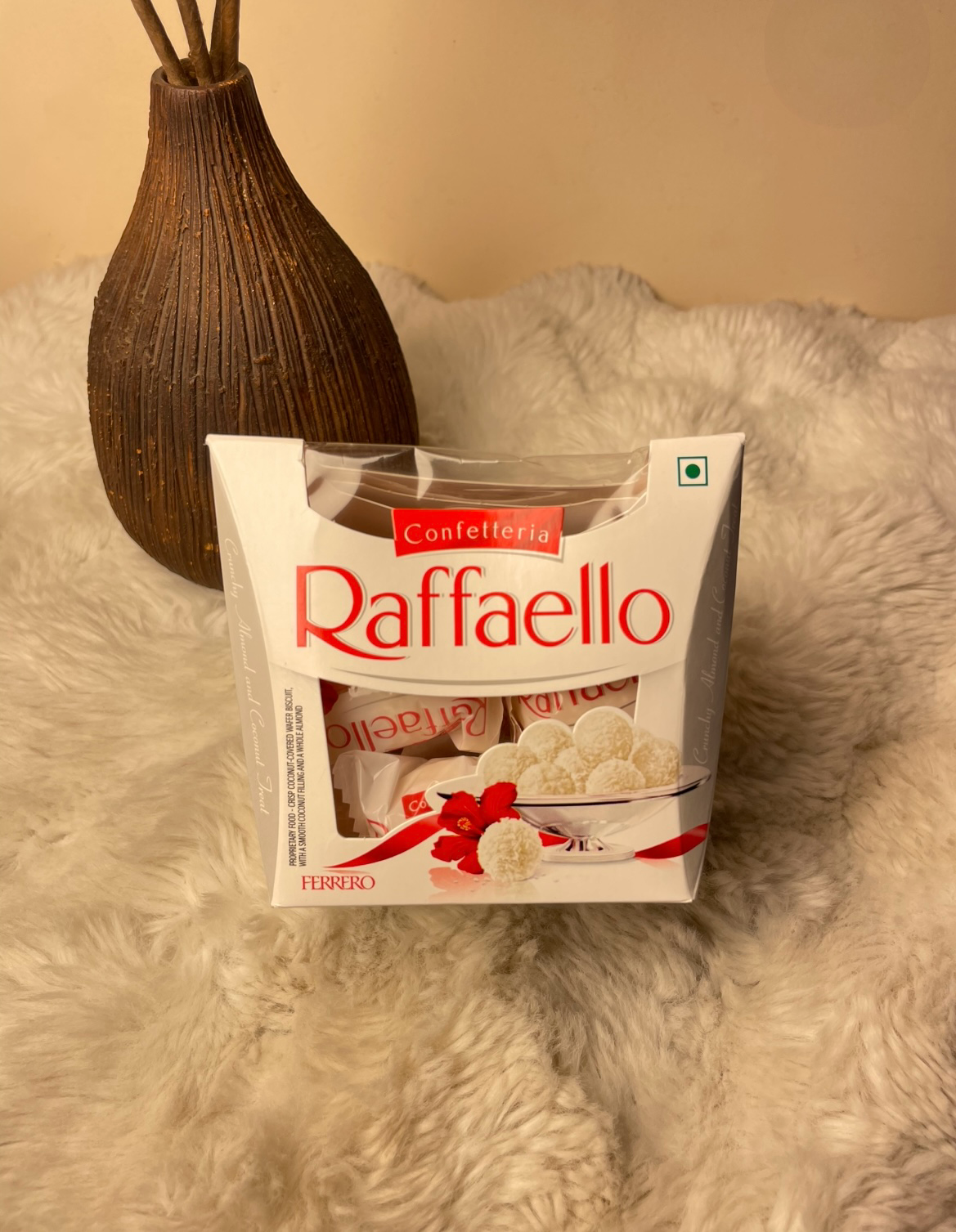 Delight in a crisp wafer shell filled with creamy coconut filling and a whole almond center, coated in delicate coconut flakes. A luxurious treat perfect for gifting and special moments. 