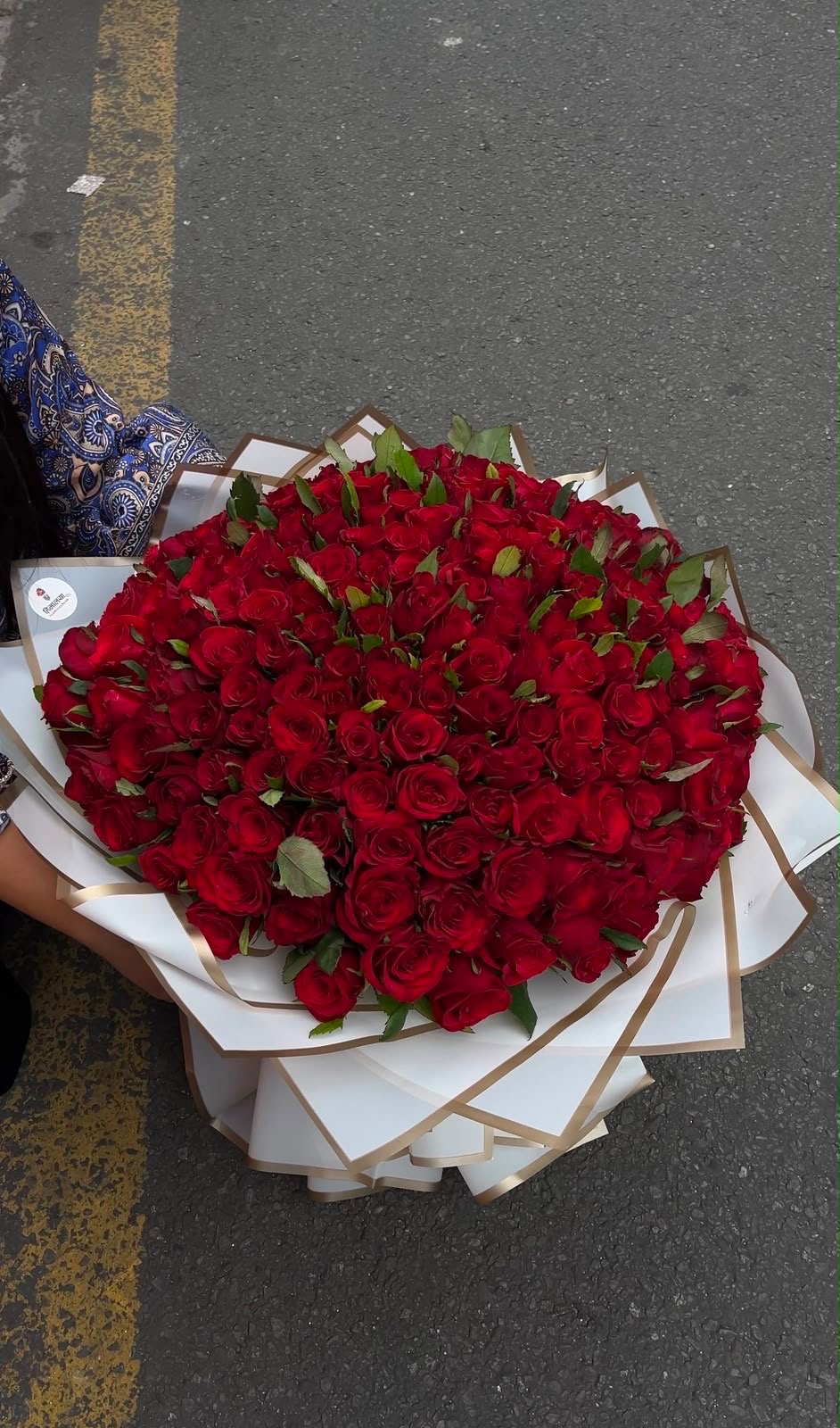 A stunning red rose bouquet designed to make a memorable impression, featuring red roses arranged with elegant white wrapping for a classic and sophisticated presentation.