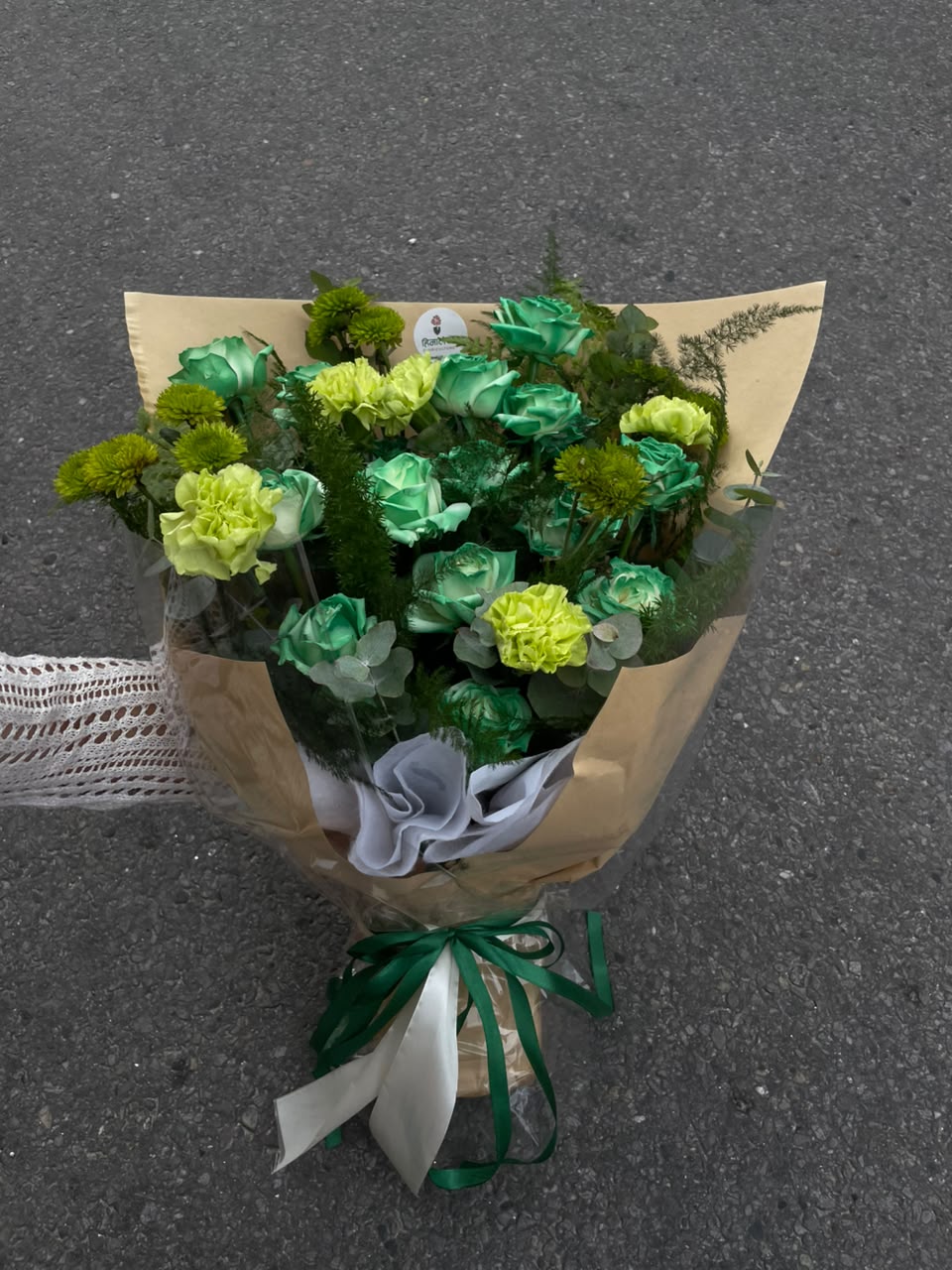 As flowers are natural products, the color, size, shape, and bloom stage may vary slightly from the product image. Green roses are dyed, so minor variations in shade may occur. Substitutions may be made with flowers of equal or higher value based on seasonal availability.