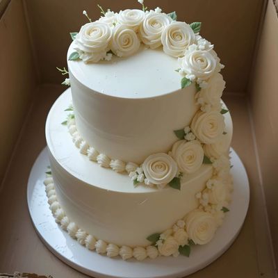 Elegant Two-Tier White Floral Celebration Cake