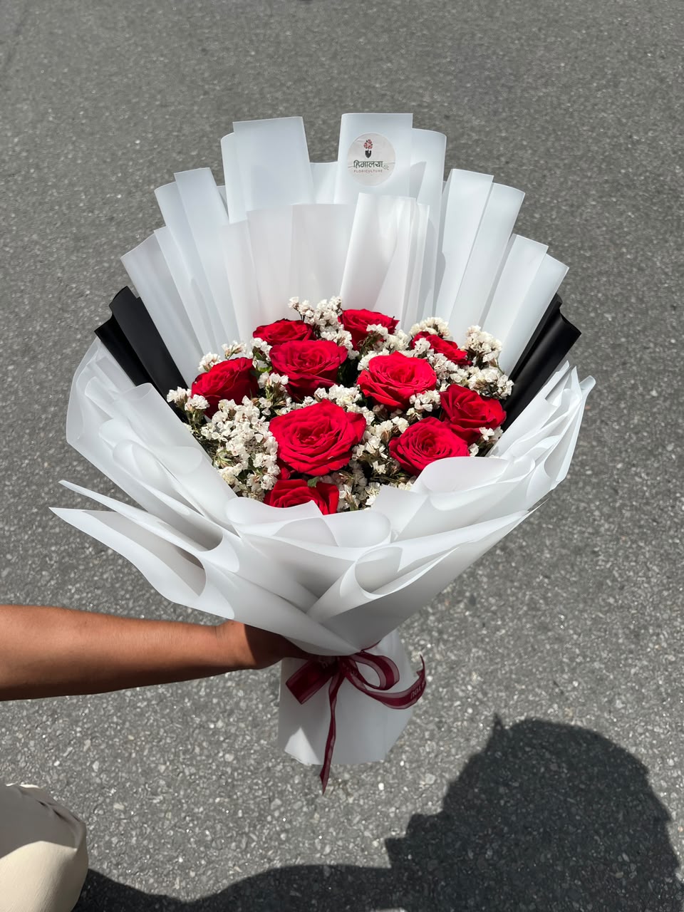 12 Red Roses with Statice or Gypsy Bouquet As flowers are natural products, the bloom stage, filler flowers (statice or gypsophila), and wrapping style may vary slightly based on seasonal availability while maintaining the same freshness and elegant presentation.
