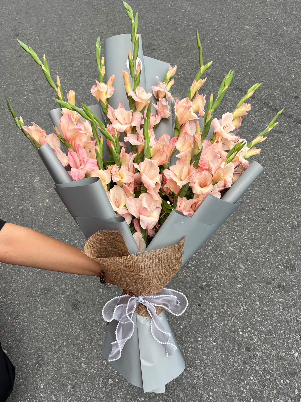 10-Stem Gladiolus Bouquet Flower colors, bloom stage, and wrapping style may vary based on seasonal availability while maintaining the same freshness, quality, and elegant presentation.