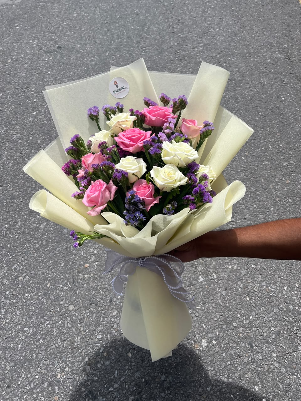 As flowers are natural products, the rose shades, bloom stage, statice arrangement, and wrapping style may vary slightly based on seasonal availability while maintaining the same freshness and elegant presentation.