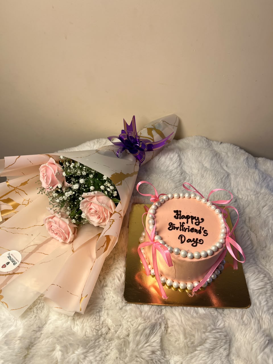 The shade of pink, cake decoration, and bouquet arrangement may vary slightly based on availability while maintaining the same elegant pink theme and quality. The cake is freshly prepared and should be refrigerated until ready to serve.