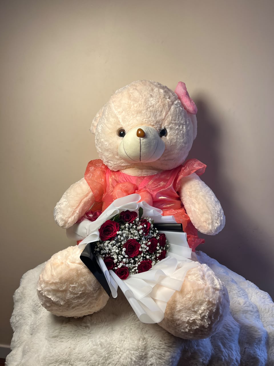 The teddy bear color and bouquet arrangement may vary slightly based on availability while maintaining the same quality and romantic theme.