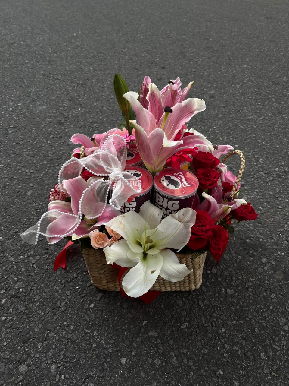 Bloom & Bites Gift Basket for Her The flower varieties, colors, and arrangement style may vary slightly based on seasonal availability while maintaining the same beauty and overall theme. Snack flavors may vary based on availability.