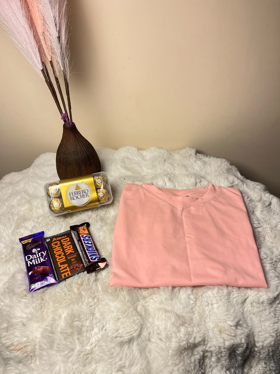T-shirt size and design availability may vary, so please mention the required size while placing your order. Chocolates are temperature-sensitive and may melt during delivery due to weather conditions. Store them in a cool place after receiving the package for the best experience.
