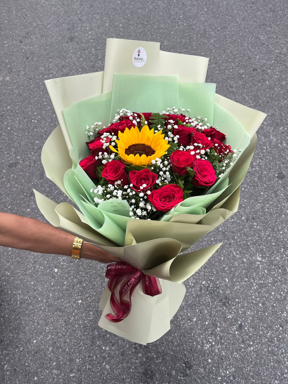 1 Sunflower & 20 Red Roses Bouquet Bloom size, flower shades, filler flowers, and wrapping may vary slightly depending on seasonal availability while maintaining the bouquet's overall style, quality, and value.