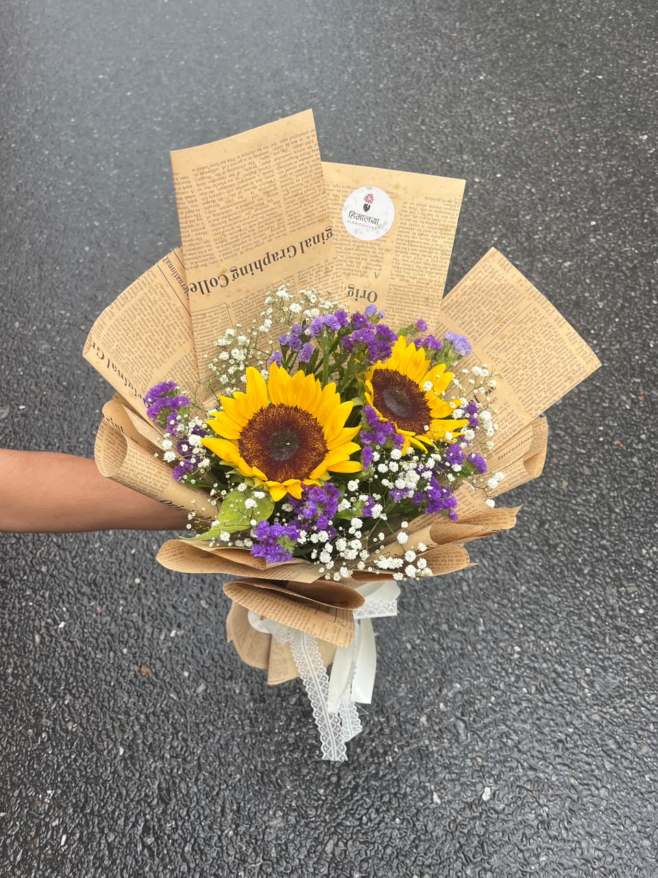 Blue statice may be substituted with blue dyed gypsophila (baby's breath) depending on seasonal availability. Flower shades, bloom sizes, and wrapping may vary slightly while maintaining the bouquet's overall style, quality, and value.