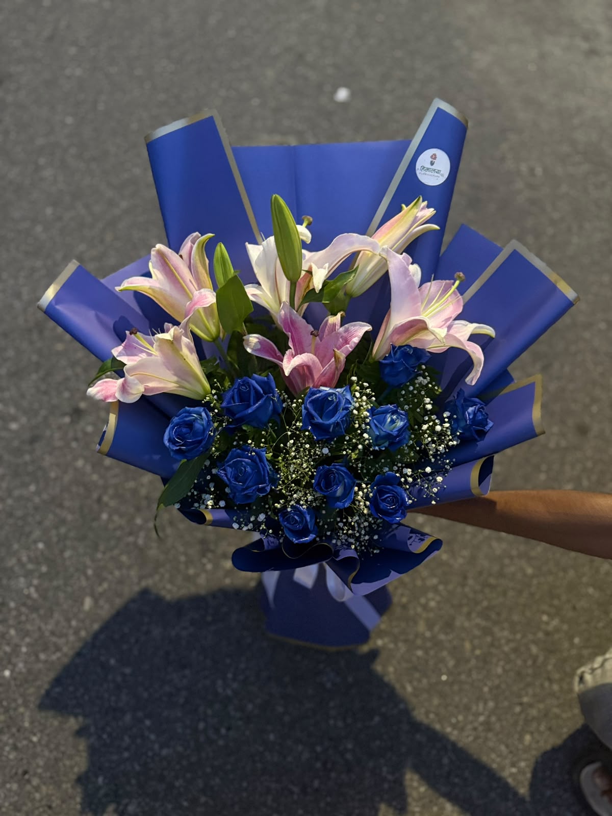 Blue Fantasy Floral Bouquet Blue roses are created using a floral dyeing process. Bloom size, flower shades, lilies may arrive in bud form, and wrapping may vary slightly depending on seasonal availability while maintaining the bouquet's overall style, quality, and value.