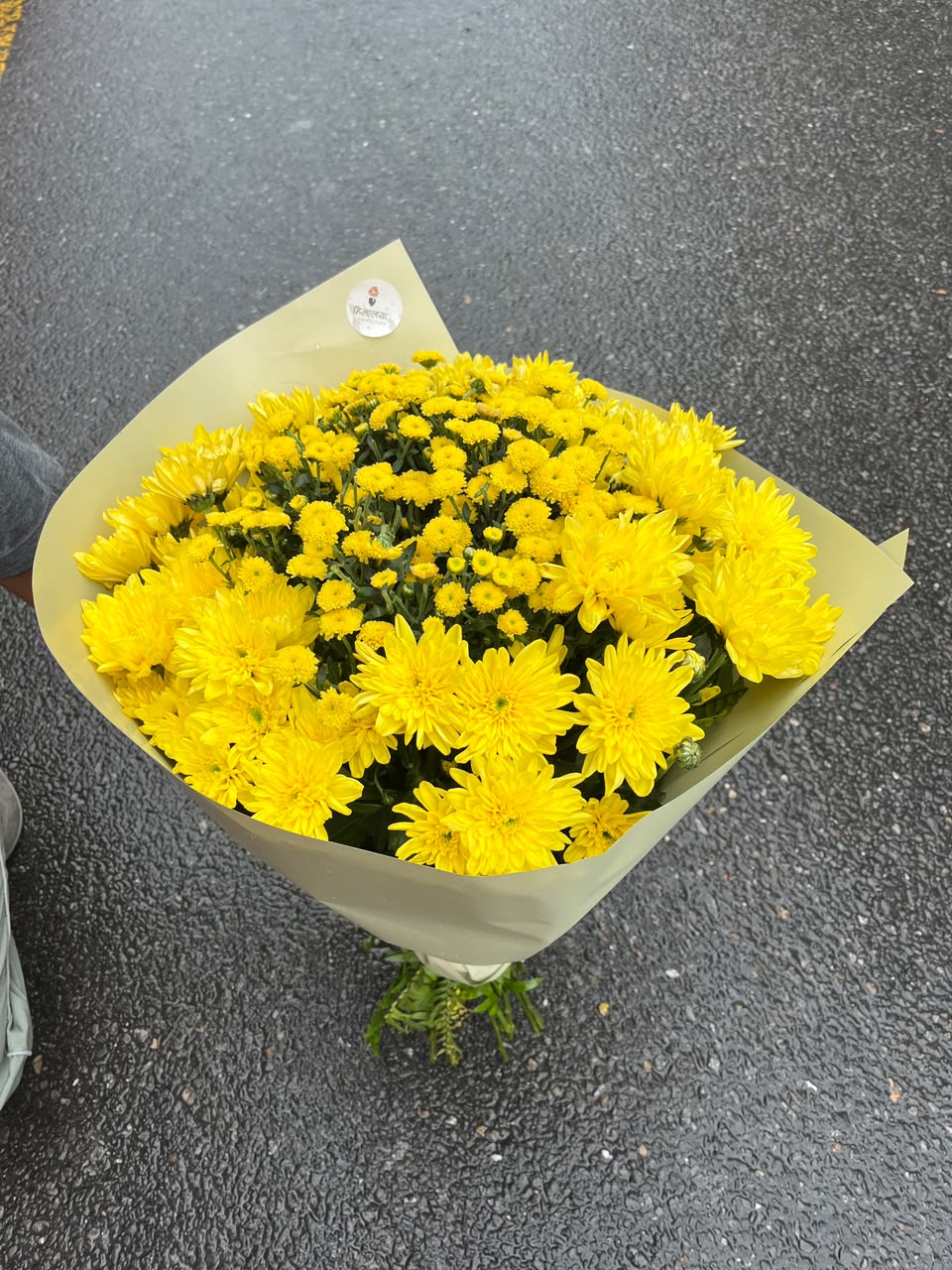 15-Stem Yellow Daisy Bouquet Bloom size, flower shades, and wrapping may vary slightly depending on seasonal availability while maintaining the bouquet's overall style, quality, and value.