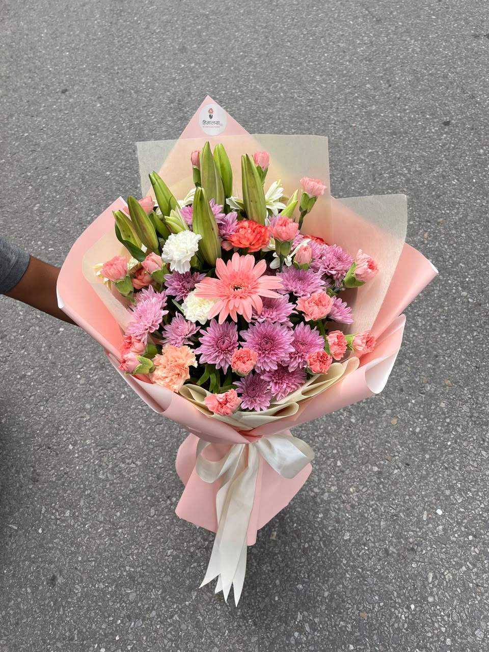 Bloom size may vary slightly depending on lily variety and seasonal availability while maintaining the overall quality, freshness, and beauty of the arrangement.