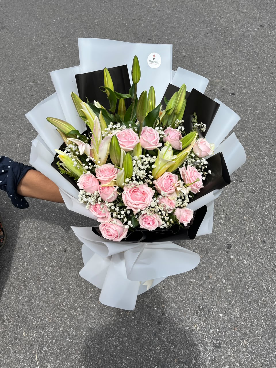 Timeless Lily & Rose Bouquet Lilies bloom size, flower shades and wrapping may vary slightly depending on seasonal availability while maintaining the bouquet's overall style, quality, and value.