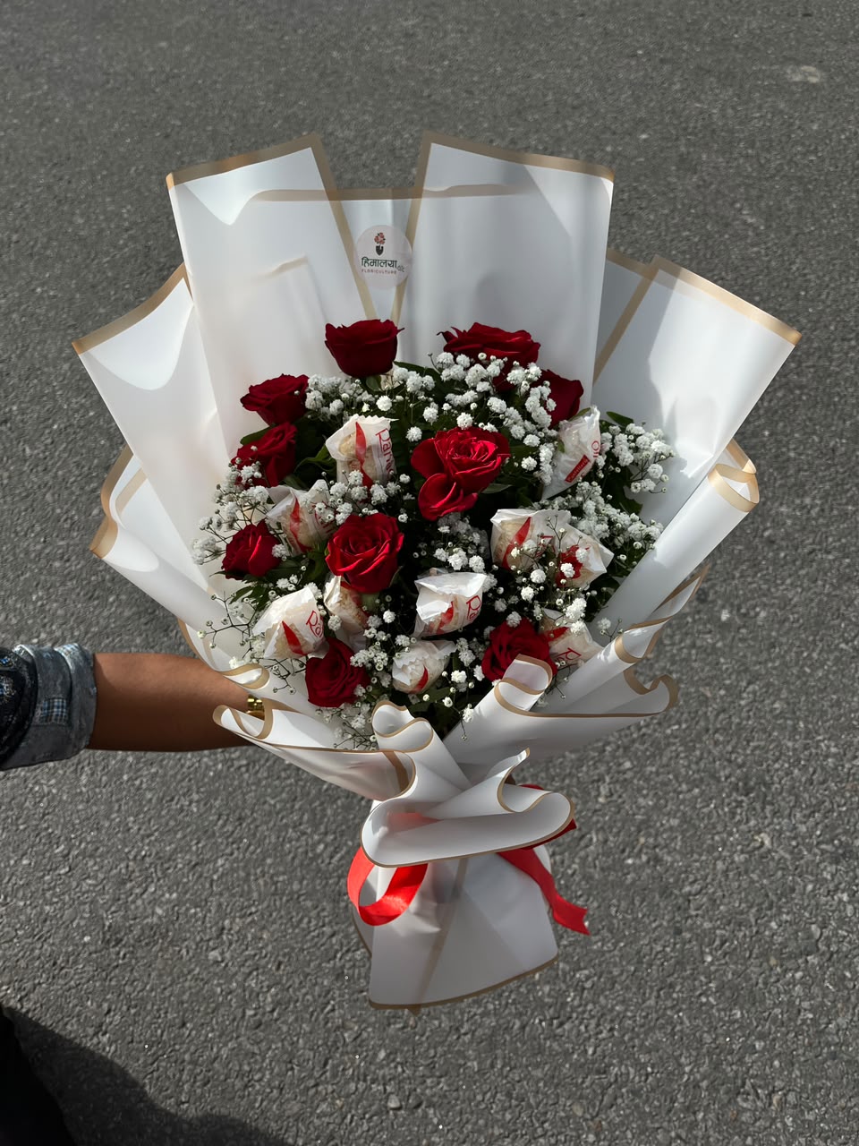 Flowers are natural products, so slight variations in color, bloom size, and arrangement may occur. Chocolate packaging and quantity may vary slightly based on availability while maintaining the same premium quality. Wrapping paper, ribbons, greenery, and decorative elements may be substituted with similar premium materials based on availability.