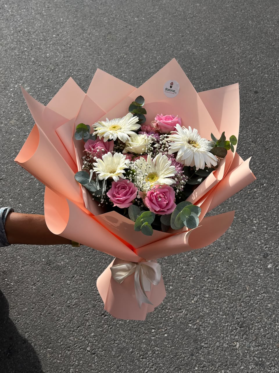 Flowers are natural products, so slight variations in color, bloom size, and arrangement may occur. Wrapping paper, ribbons, greenery, and fillers may be substituted with similar premium materials based on seasonal availability while maintaining the overall design and quality of the bouquet.
