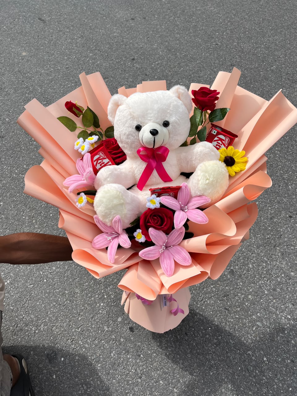 Special Moments Gift Combo – Teddy, Flowers & Sweets This product contains artificial flowers and decorative items intended for long-lasting display. Slight variations in flower color, size, arrangement, teddy design, chocolate packaging, and decorative materials may occur based on availability. Any substitutions will be made with similar-quality items while maintaining the overall look and value of the arrangement.