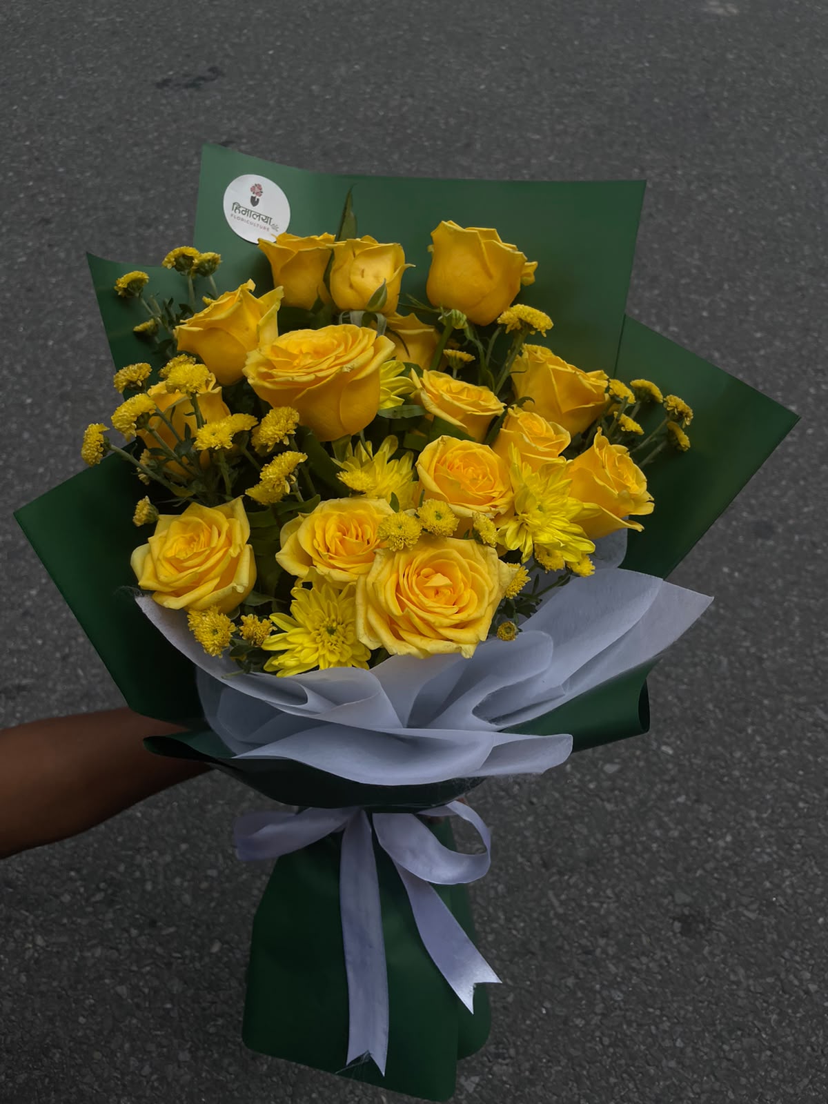 20-Stem Yellow Mixed Bouquet Flower colour, size, shape, and bloom stage may vary slightly due to the natural characteristics and seasonal availability of flowers. Wrapping, greenery, and filler flowers may also vary while maintaining the overall design, quality, and value of the bouquet.