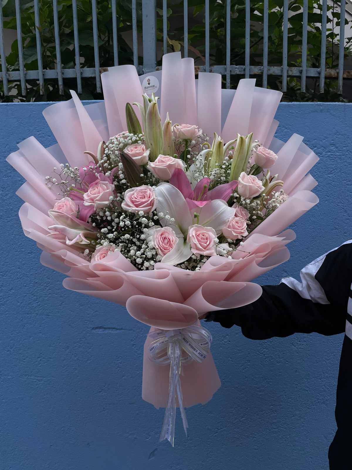 Pastel Rose & Lily Bouquet Flower colours, varieties, size, shape, and bloom stage may vary slightly due to natural characteristics and seasonal availability. Wrapping, greenery, and filler flowers may also vary while maintaining the overall design, quality, and value of the bouquet.