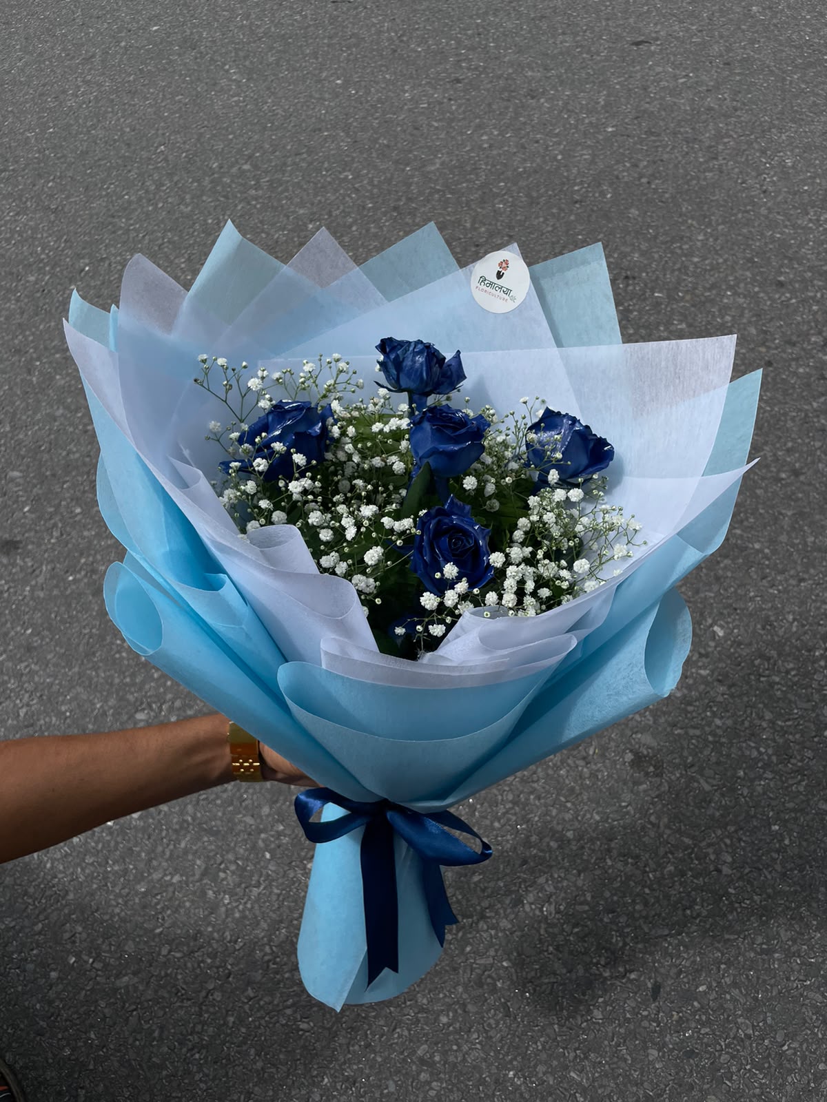 Blue Dream Bouquet Dyed roses may have slight variations in colour intensity, size, and appearance due to the natural characteristics of the flowers and the dyeing process. Gypsy flowers, greenery, and wrapping may also vary slightly depending on availability while maintaining the overall design, quality, and value of the bouquet.