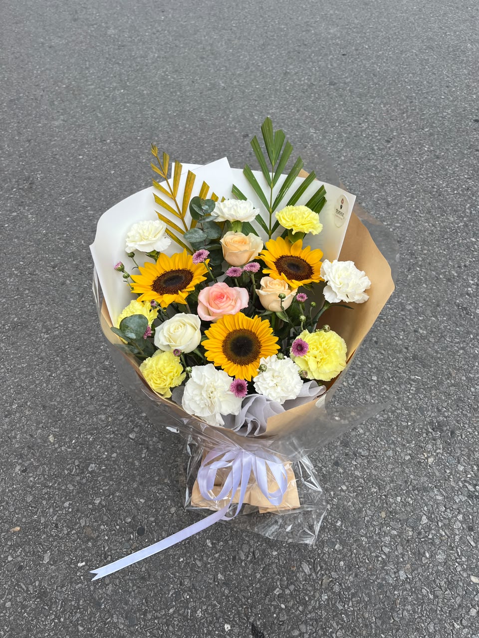 Flower colours, varieties, size, shape, and bloom stage may vary slightly due to natural characteristics and seasonal availability. Wrapping, greenery, and filler flowers may also vary while maintaining the overall design, quality, and value of the bouquet.