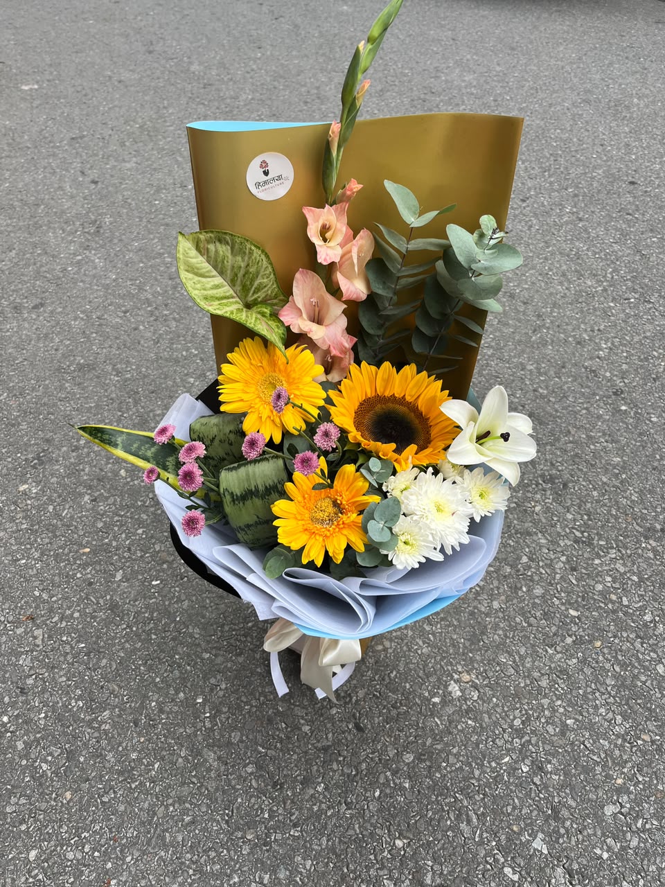 Cheerful Garden Mix Flower colours, varieties, size, shape, and bloom stage may vary slightly due to natural characteristics and seasonal availability. Wrapping, greenery, and filler flowers may also vary while maintaining the overall design, quality, and value of the bouquet.