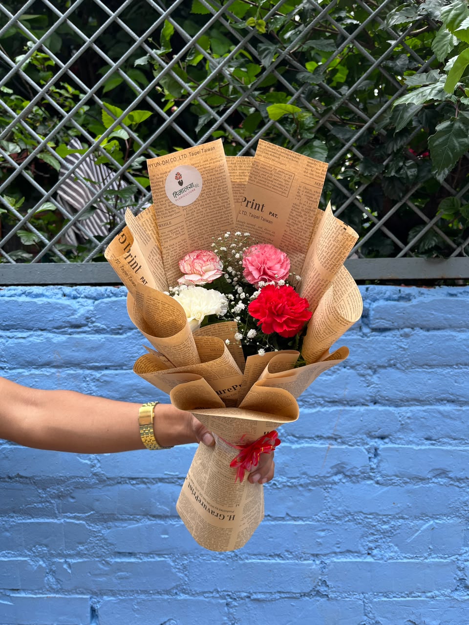 Carnation colours, size, shape, and bloom stage may vary slightly due to natural characteristics and seasonal availability. Wrapping, greenery, and filler flowers may also vary while maintaining the overall design, quality, and value of the bouquet.