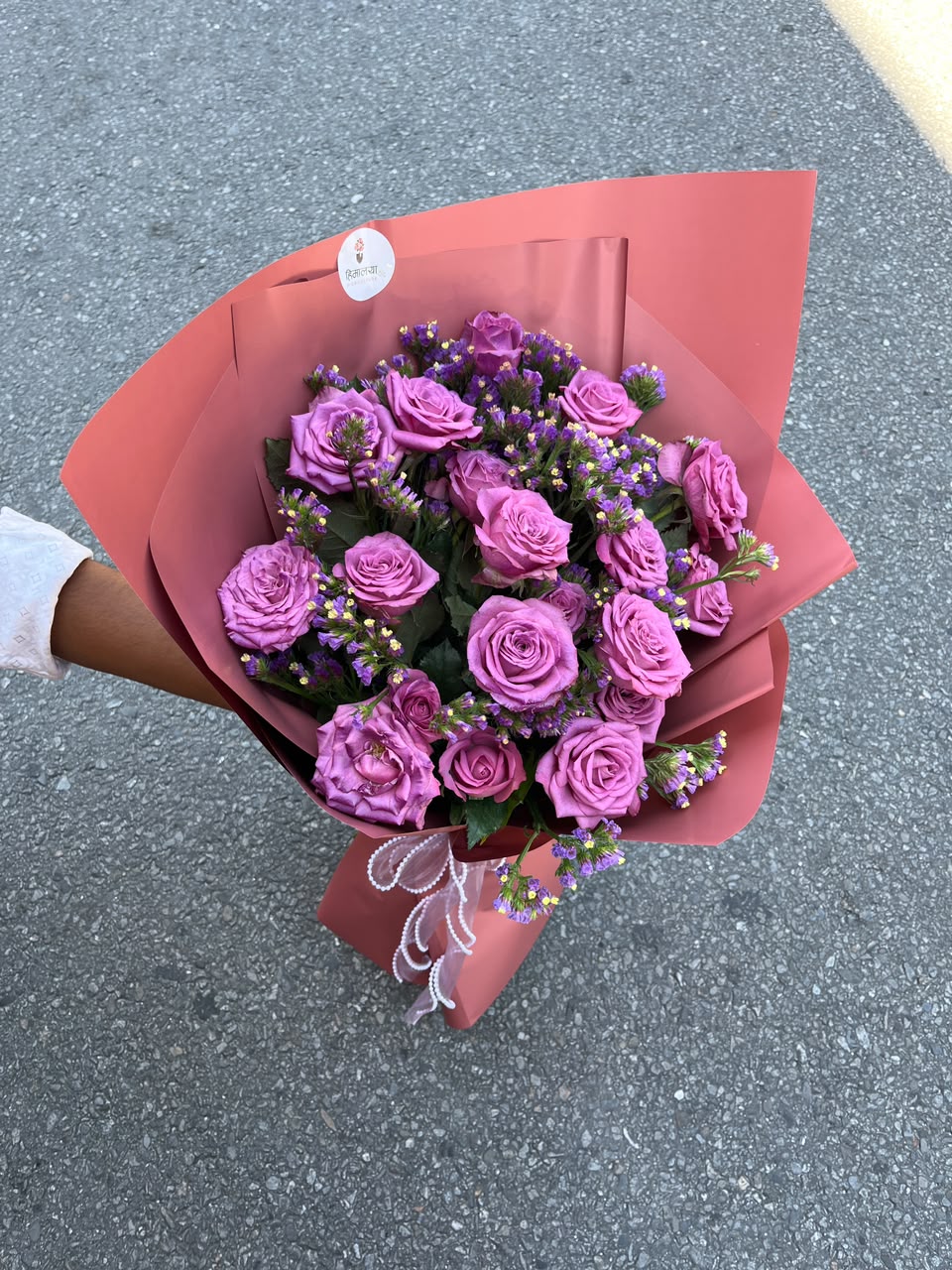Purple 21 Statice filler may be replaced with Gypsophila (Baby’s Breath) or another suitable filler depending on seasonal availability, while maintaining the overall look and quality of the bouquet