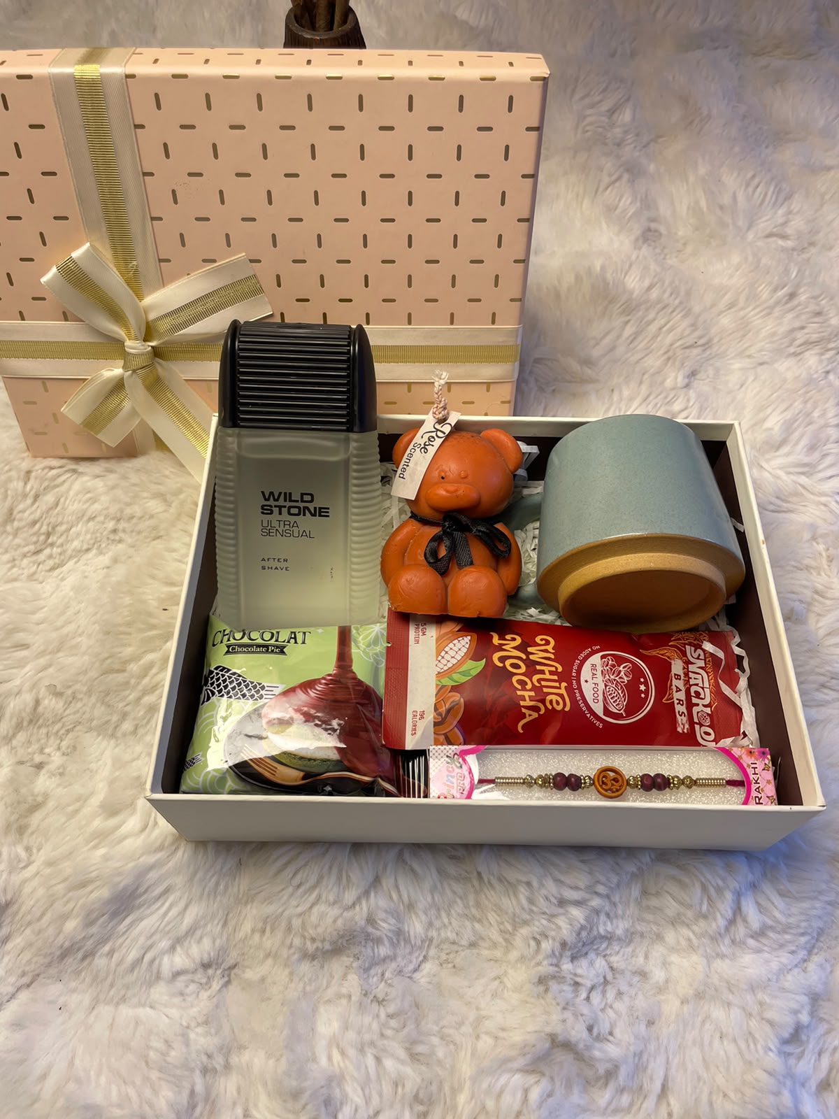 Product brands, fragrances, mug designs, candle scents, and packaging may vary depending on availability while maintaining the overall quality and value of the gift set. Food and beverage products are subject to their respective manufacturer's ingredients, allergen information, and expiry dates. Product images are for illustrative purposes, and slight variations in appearance or packaging may occur.