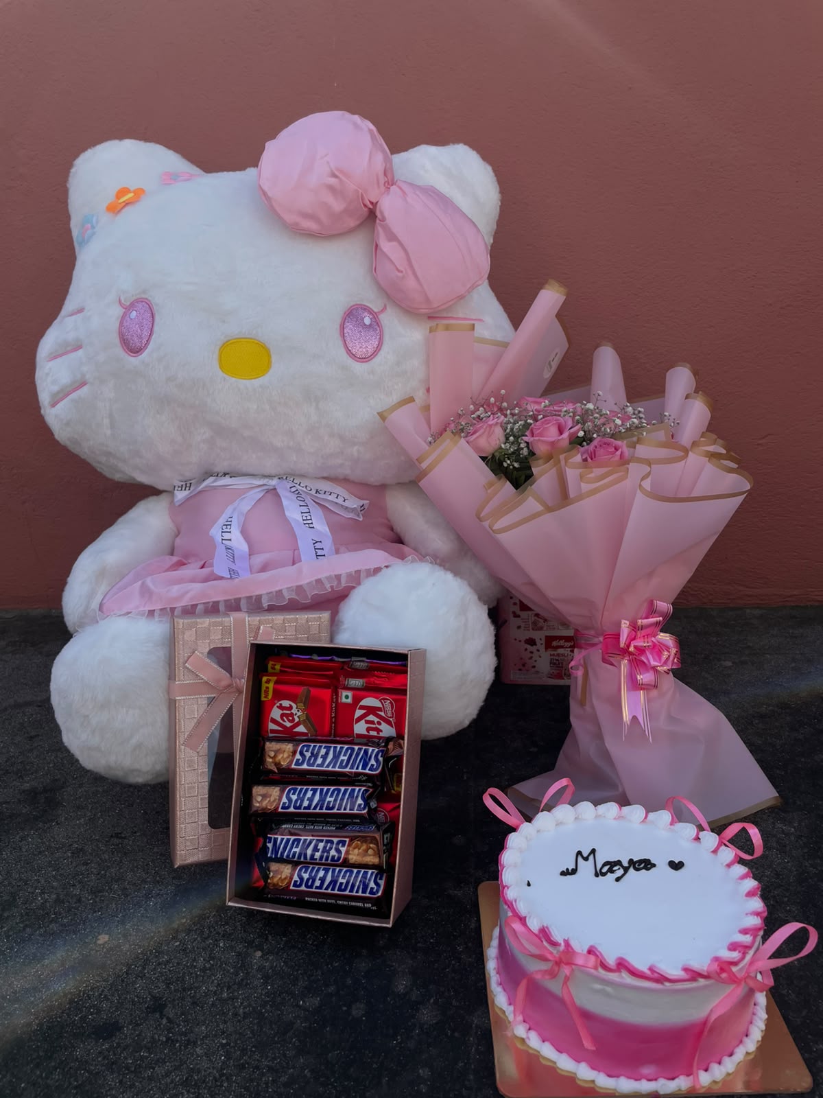 Cake flavor, design, and decoration may vary depending on availability while maintaining the overall quality and value of the product. Rose colors and flower varieties may vary based on seasonal availability. Hello Kitty doll design and size may have slight variations. Chocolate brands, flavors, and packaging are subject to availability. All food products are subject to their respective manufacturer's ingredients, allergen information, and expiry dates. Product images are for illustrative purposes, and minor variations may occur.