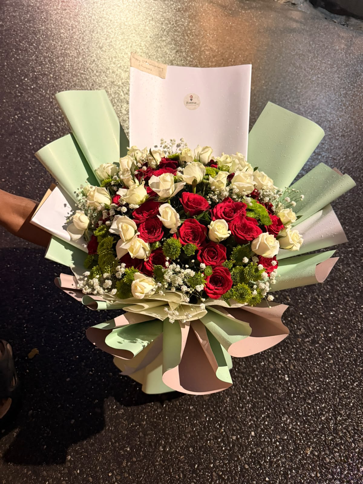 Flower colors, varieties, sizes, and bloom stages may vary slightly depending on seasonal availability. The bouquet will be arranged to maintain the overall color combination, fullness, quality, and value shown. As flowers are natural products, minor variations in shape, size, and appearance are normal. Premium wrapping style and decorative elements may vary based on availability.