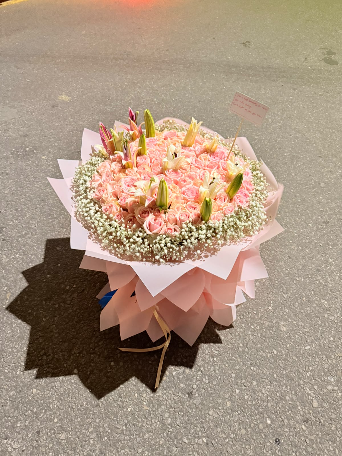Pastel rose shades, rose varieties, lily colors, sizes, and bloom stages may vary depending on seasonal availability. As flowers are natural products, slight variations in color, size, shape, and appearance are normal. The bouquet will be arranged to maintain the overall fullness, elegance, quality, and value shown. Wrapping style and decorative elements may vary depending on availability.