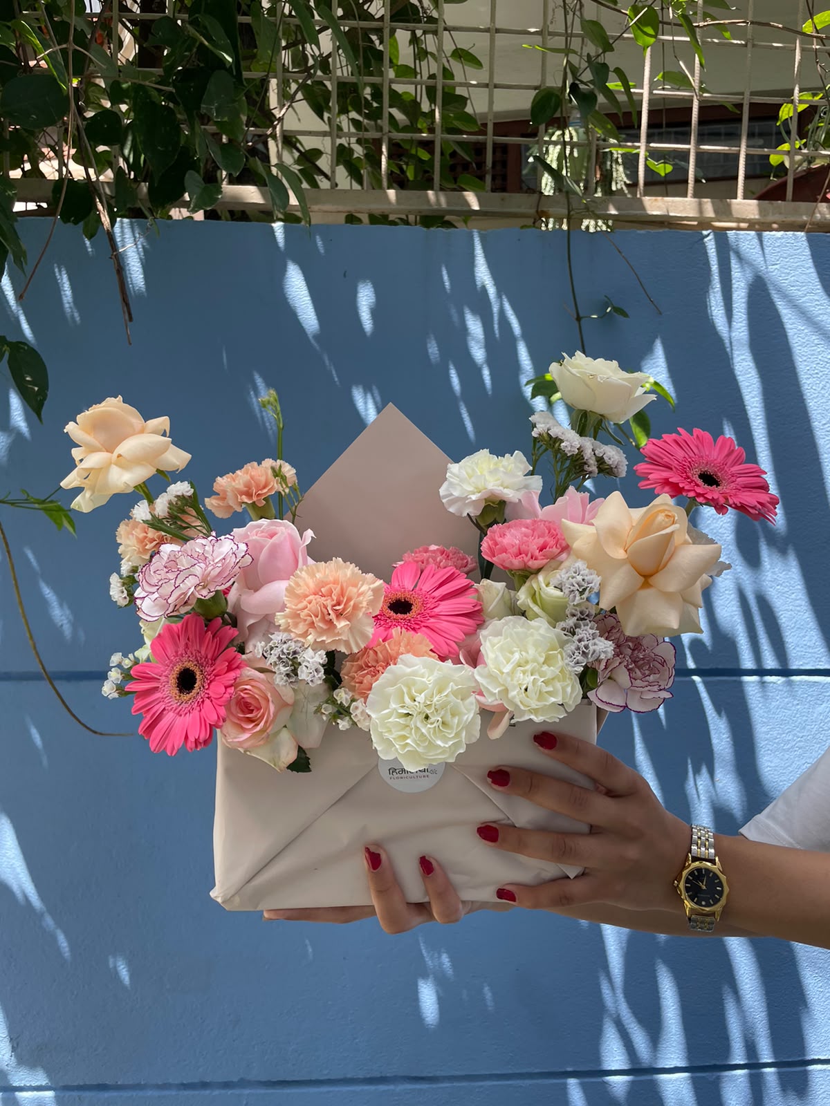 22-Stem Mixed Flowe Envelope Bouquet Flower varieties, colors, sizes, and filler flowers may vary depending on seasonal availability. The bouquet will contain 22 flower stems, while the specific flower varieties may be substituted with similar flowers of equal or greater value to maintain the overall look, freshness, and color combination.