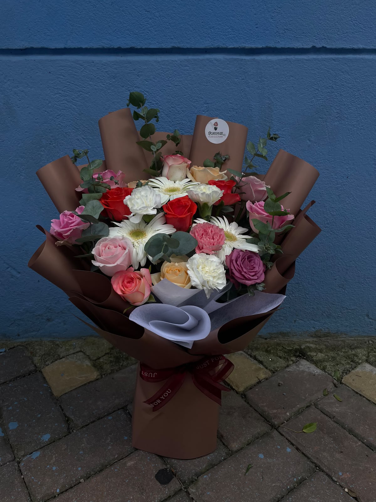 Choose this bouquet for its rich variety of flowers and elegant color combination. The mix of vibrant and pastel shades gives it a luxurious, lively appearance, while the premium light brown wrapping adds a warm and sophisticated finish. It is a versatile bouquet that can beautifully express love, gratitude, congratulations, or warm wishes on any special occasion.