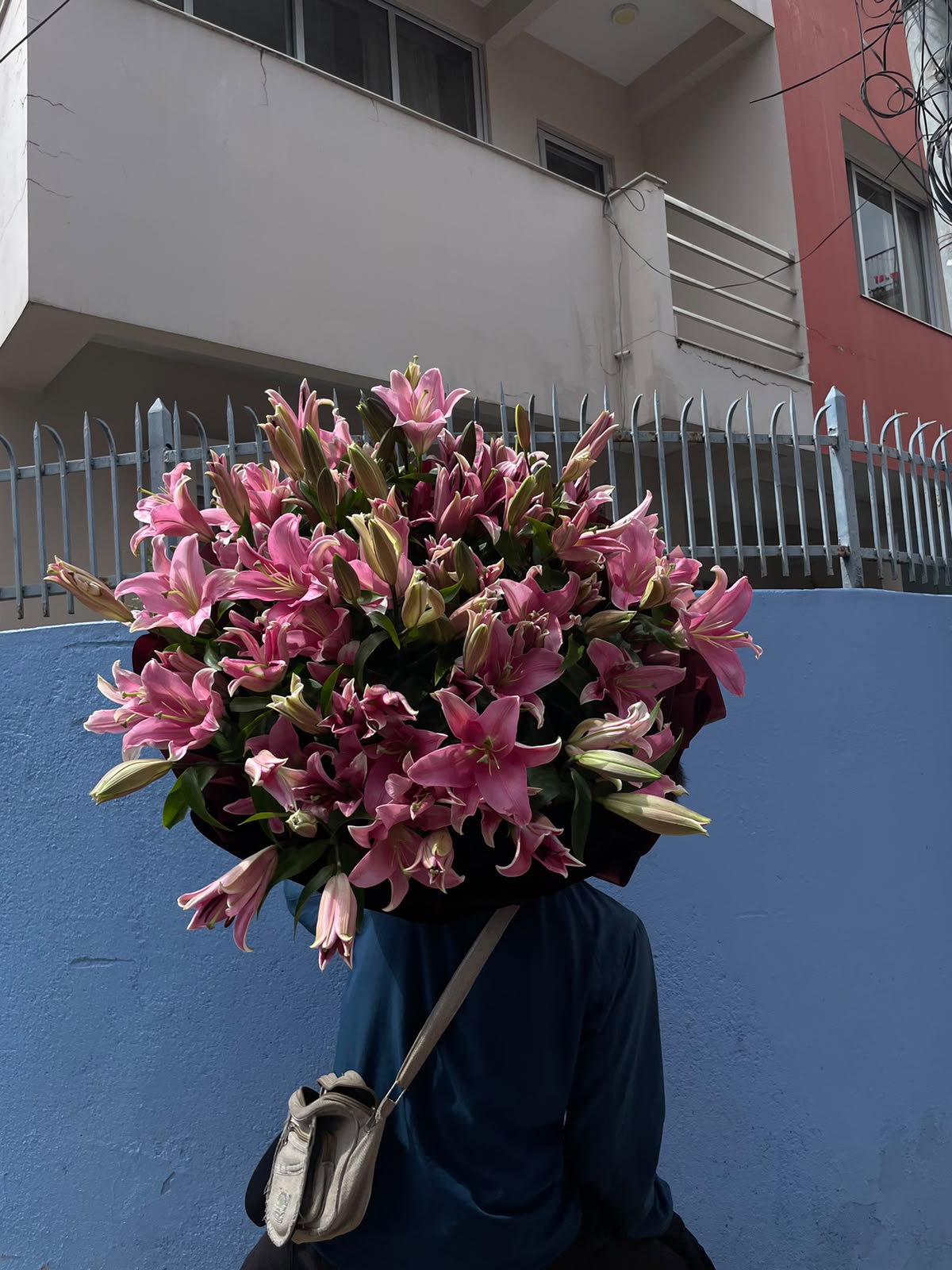 Flower color, size, and freshness may vary slightly depending on seasonal and market availability. If pink lilies are unavailable, flowers of similar value and appearance may be substituted. Wrapping and ribbon colors may also vary based on availability