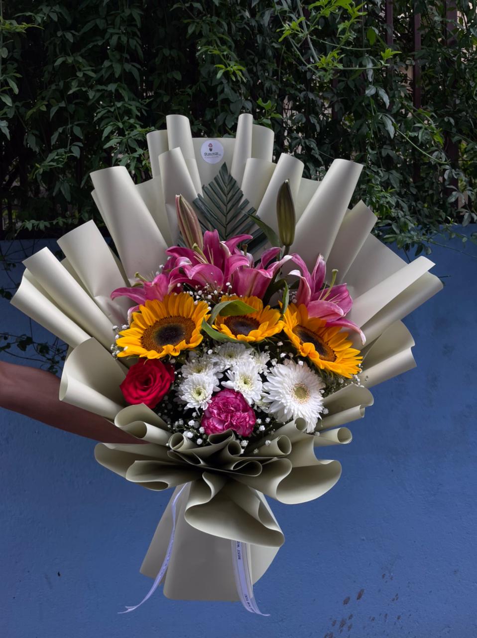 Flower colors, varieties, sizes, and availability may vary depending on the season and market availability. If any flower is unavailable, it may be replaced with a similar flower while maintaining the overall look, freshness, and value of the bouquet.