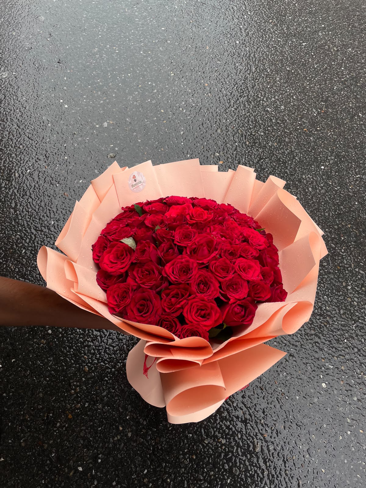 Rose color, size, bloom stage, greenery, and wrapping may vary slightly depending on seasonal availability.